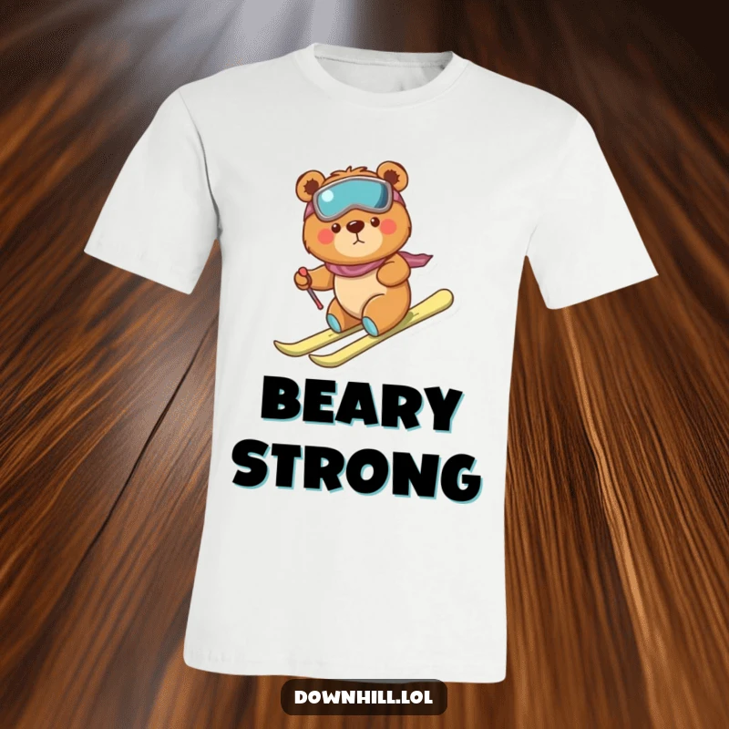 Funny, tiny, determined bear on a t-shirt, wearing skis and descending a snowy hill with brave clumsiness.